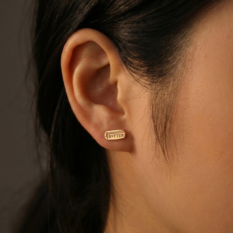 Pair of small gold stick of butter stud earrings with wrapper detail (16 of 16)