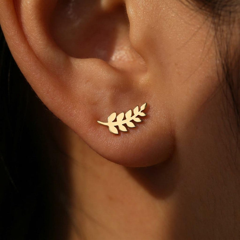 Slender gold olive branch stud earrings with leaves along a thin sprig (2 of 12)