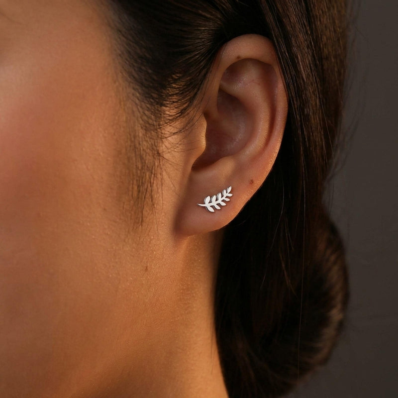 Slender gold olive branch stud earrings with leaves along a thin sprig (3 of 12)