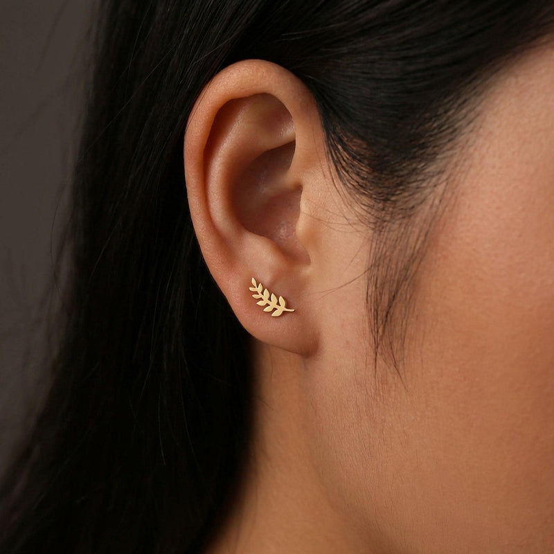 Slender gold olive branch stud earrings with leaves along a thin sprig (4 of 12)