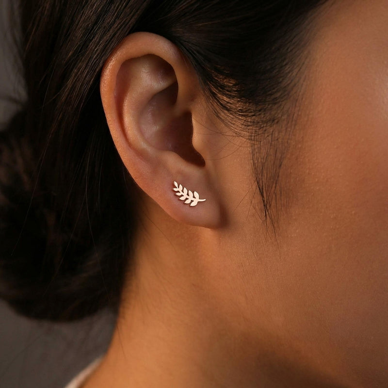 Slender gold olive branch stud earrings with leaves along a thin sprig (5 of 12)