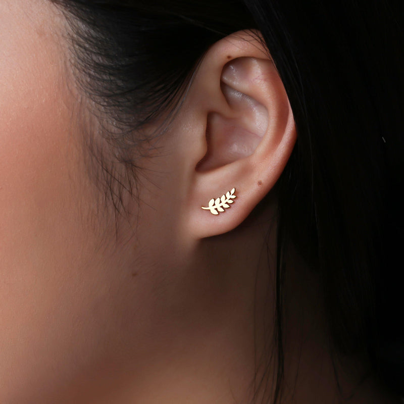 Slender gold olive branch stud earrings with leaves along a thin sprig (6 of 12)
