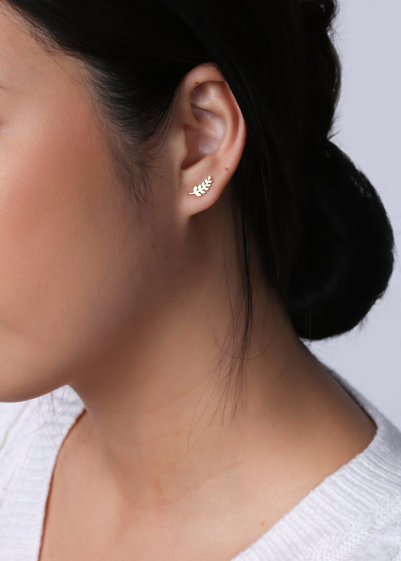 Slender gold olive branch stud earrings with leaves along a thin sprig (8 of 12)