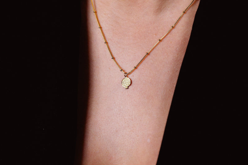 Gold cut pomegranate pendant showing seeds, on a fine cable chain (5 of 9)