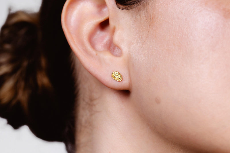 Pair of tiny gold baked potato stud earrings split open with butter on top (2 of 8)