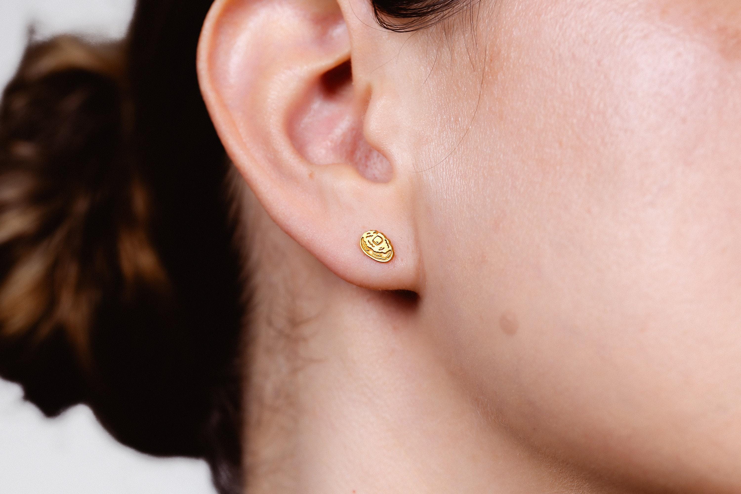 Pair of tiny gold baked potato stud earrings split open with butter on top (2 of 8)