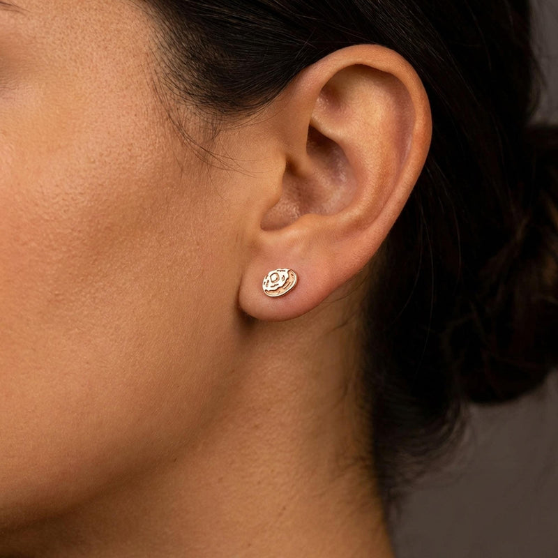Pair of tiny gold baked potato stud earrings split open with butter on top (5 of 8)