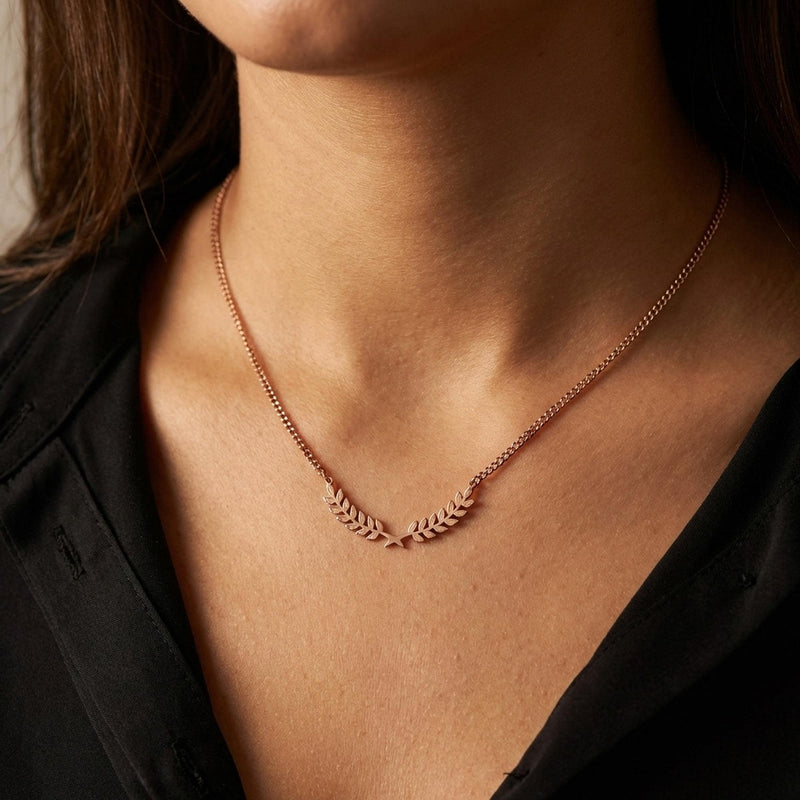 Slim curved gold olive branch pendant with two leaves on a fine chain (12 of 12)