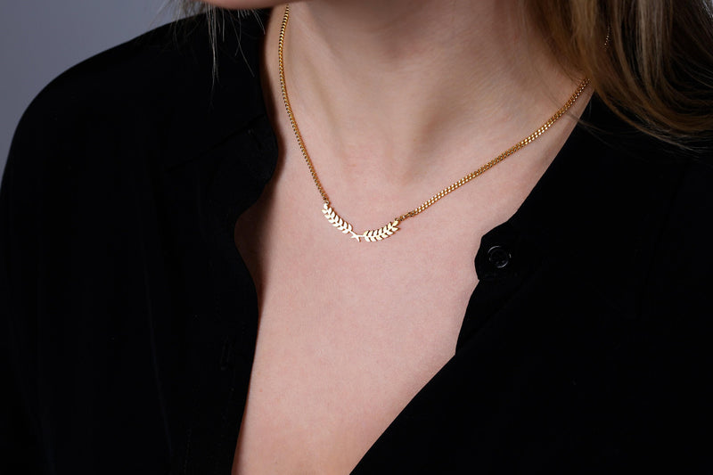 Slim curved gold olive branch pendant with two leaves on a fine chain (5 of 12)