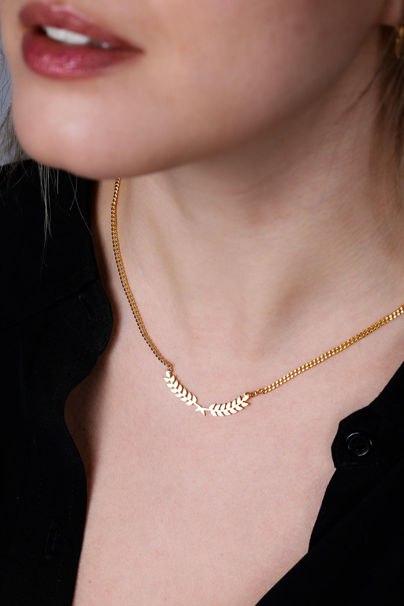 Slim curved gold olive branch pendant with two leaves on a fine chain (6 of 12)