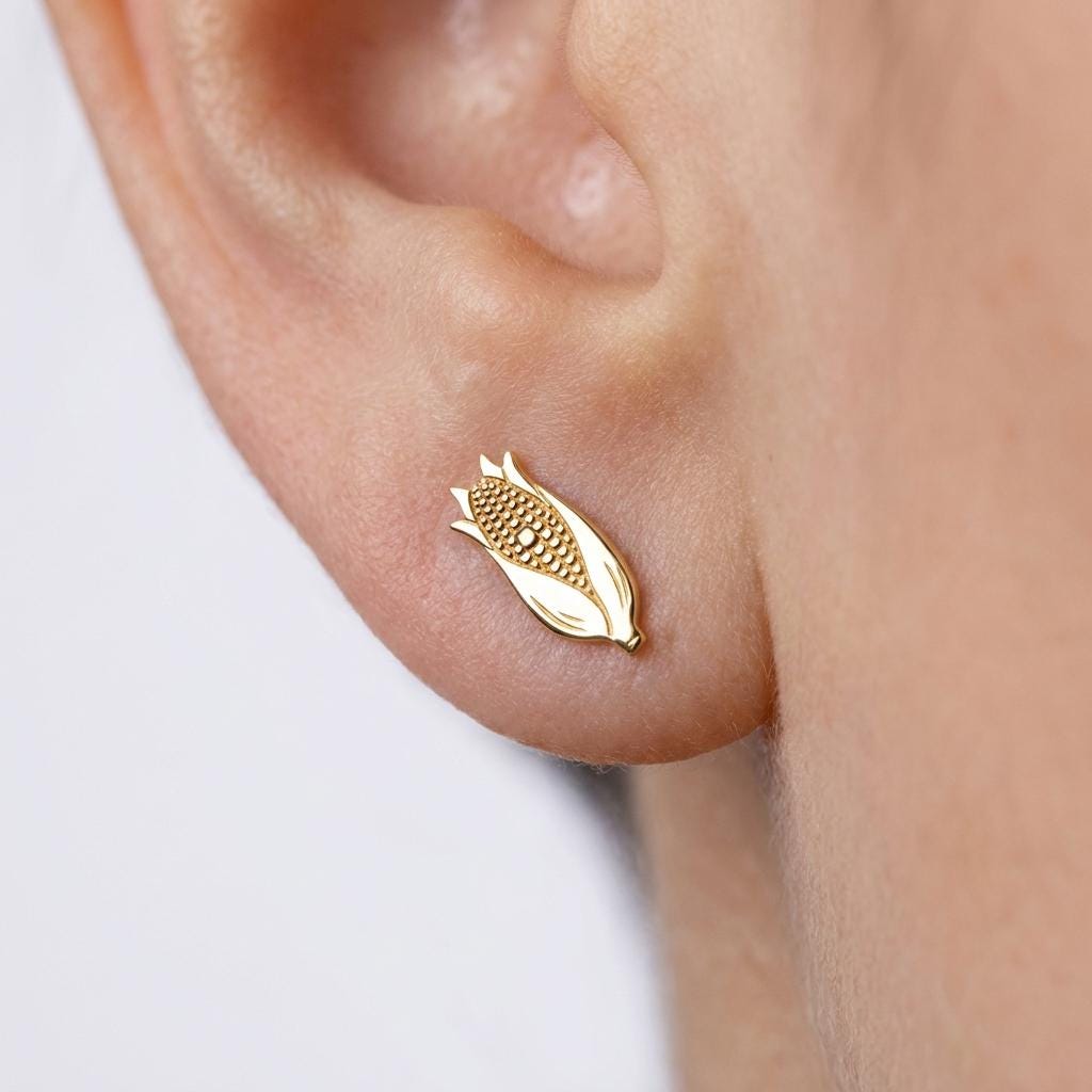 Pair of small gold corn cob stud earrings with textured kernels and pulled back husks.