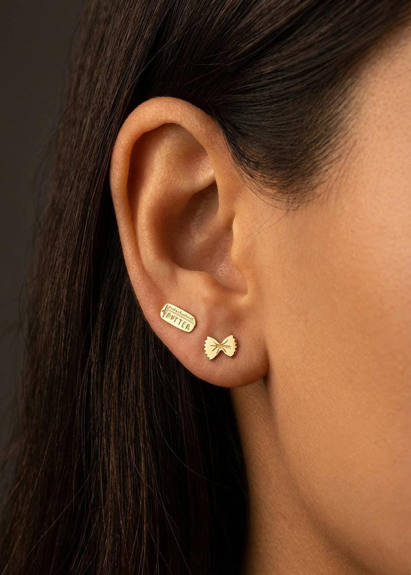 Mismatched gold stud earrings, a butter pat and a pasta twist (2 of 12)