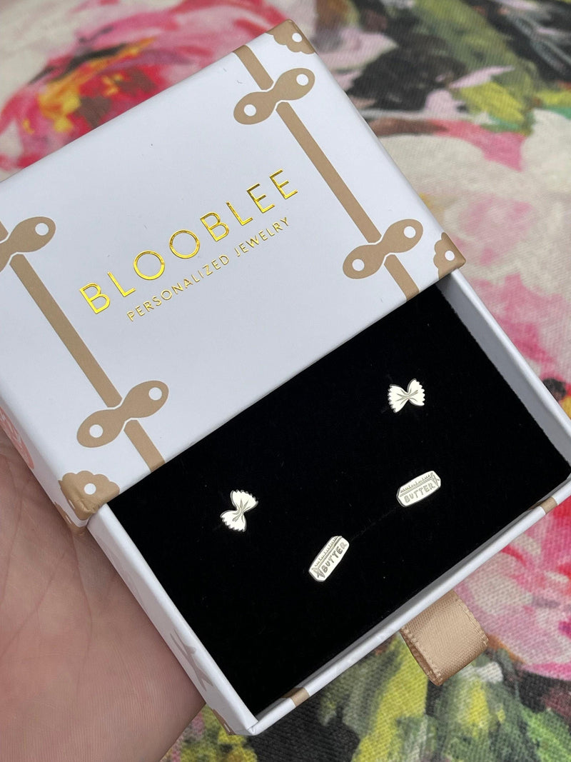 Mismatched gold stud earrings, a butter pat and a pasta twist (3 of 12)