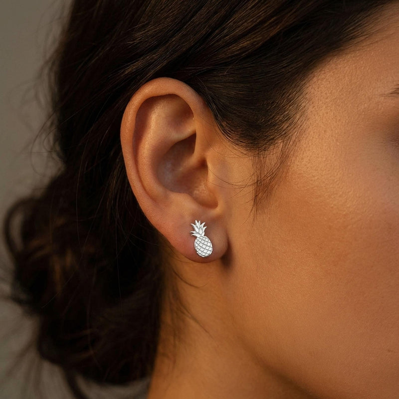 Pair of tiny gold pineapple stud earrings with crosshatch texture, on white (3 of 12)