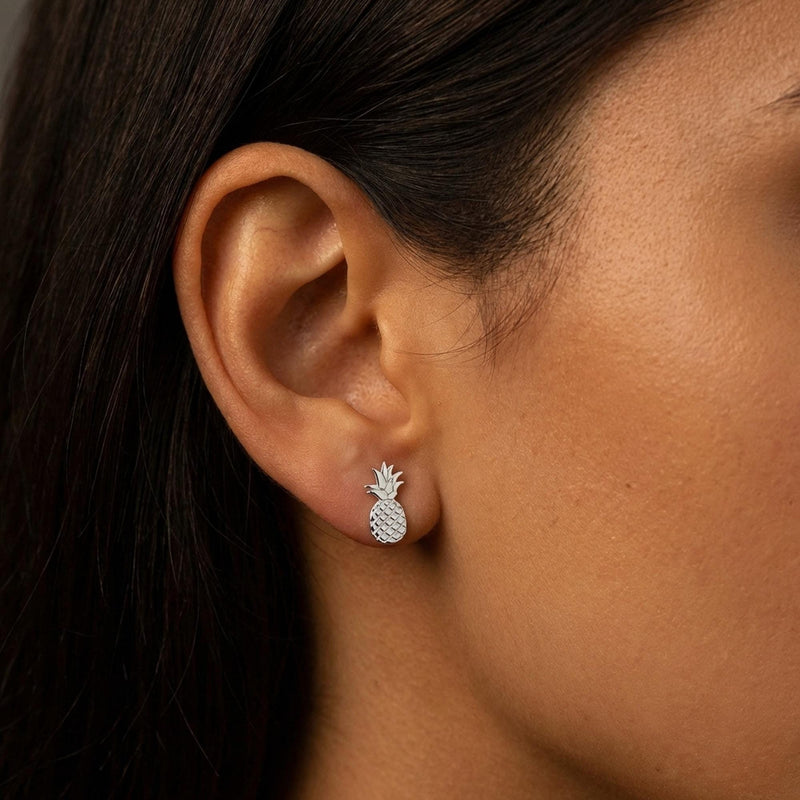 Pair of tiny gold pineapple stud earrings with crosshatch texture, on white (5 of 12)