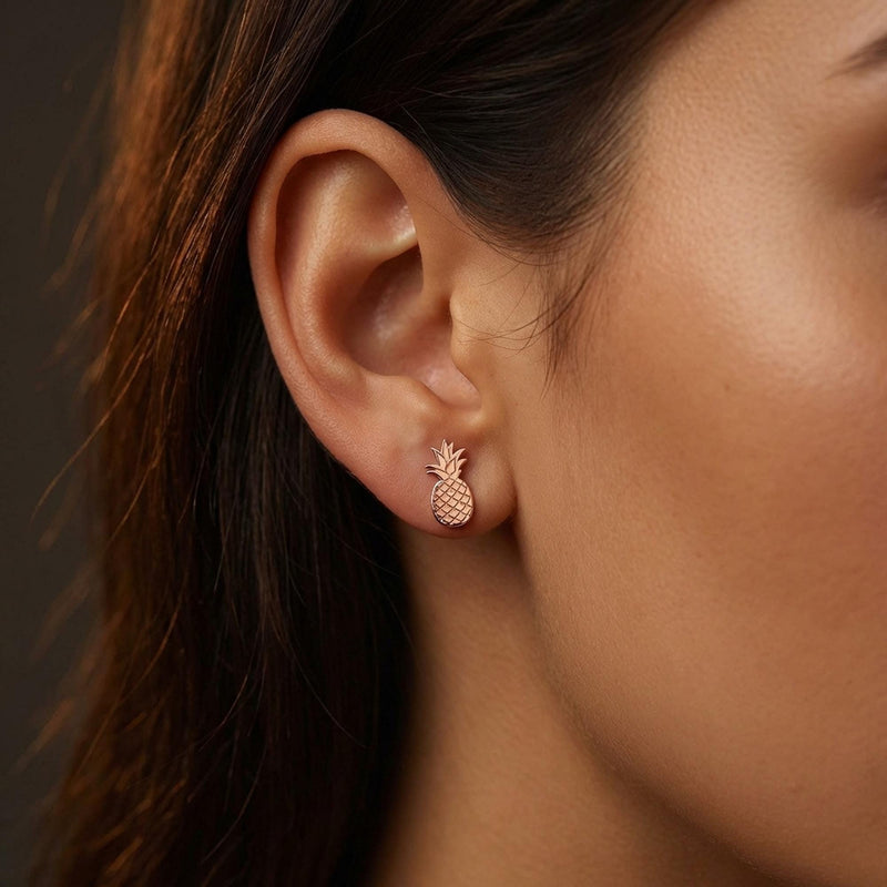 Pair of tiny gold pineapple stud earrings with crosshatch texture, on white (6 of 12)