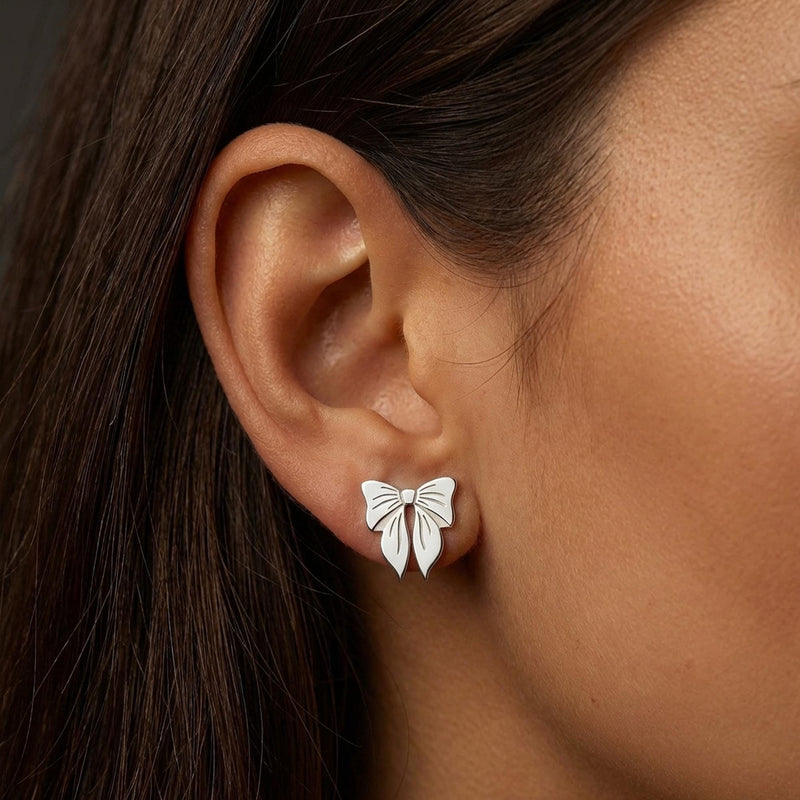 Pair of small ribbon bow stud earrings in gold with two loops and short tails (4 of 10)