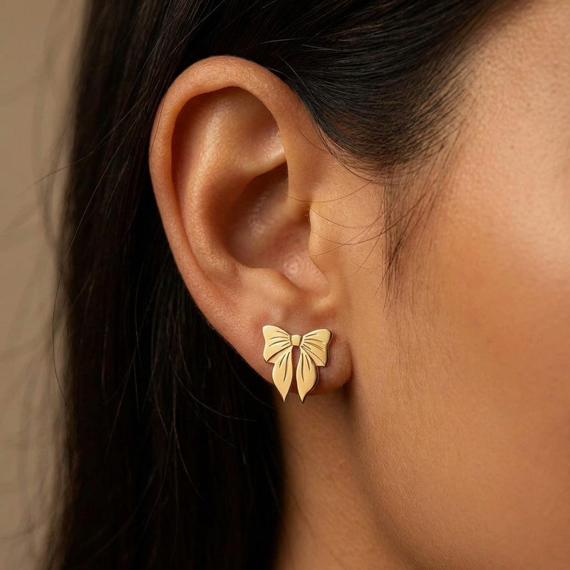 Pair of small ribbon bow stud earrings in gold with two loops and short tails (5 of 10)