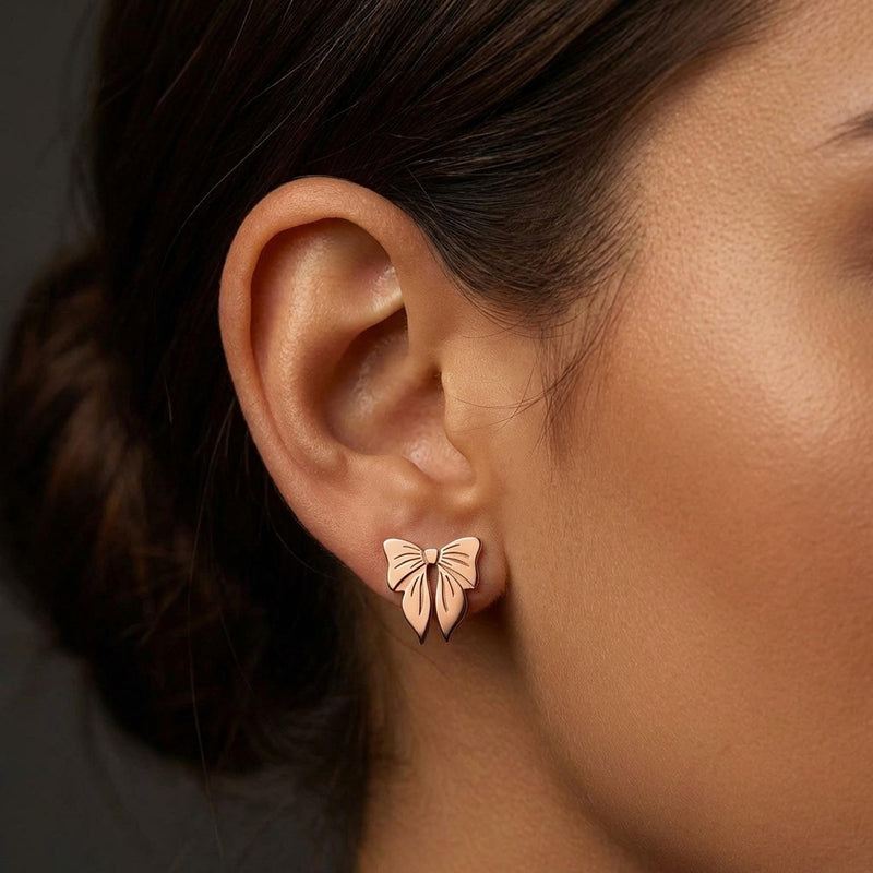 Pair of small ribbon bow stud earrings in gold with two loops and short tails (6 of 10)