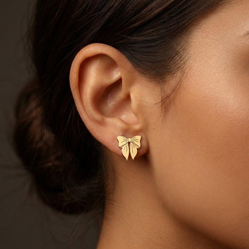 Pair of small ribbon bow stud earrings in gold with two loops and short tails (7 of 10)
