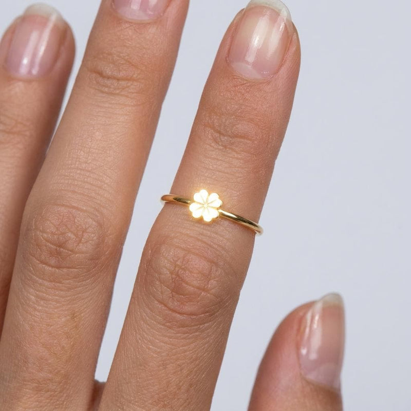 Thin gold stacking ring with a small flat four leaf clover on the band (2 of 6)