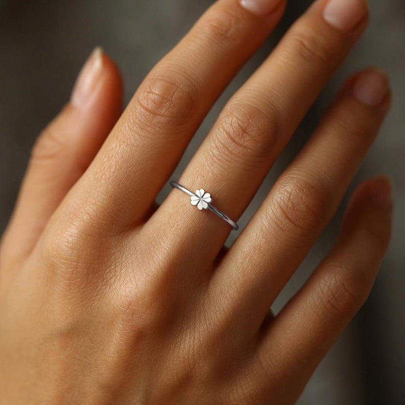 Thin gold stacking ring with a small flat four leaf clover on the band (3 of 6)