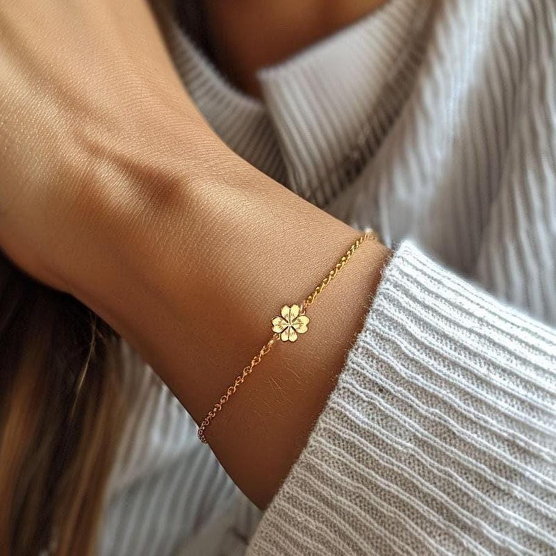 Fine chain bracelet with a flat gold four leaf clover charm. (6 of 6)