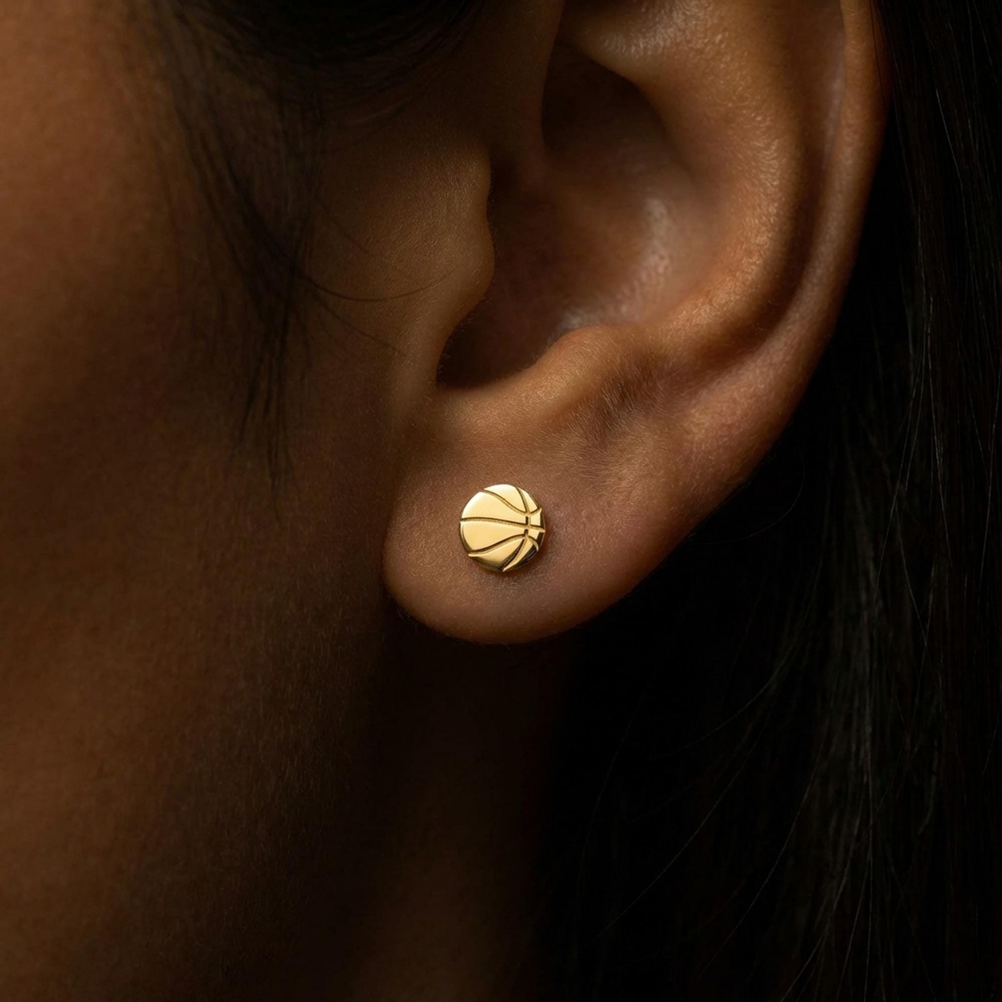 Pair of round gold basketball stud earrings with cut seam lines (2 of 11)
