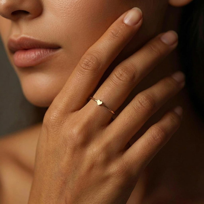 Thin gold stacking ring with a small flat heart on the top of the band (3 of 8)
