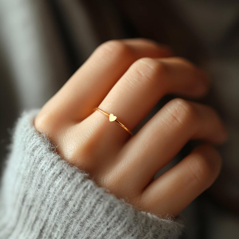Thin gold stacking ring with a small flat heart on the top of the band (7 of 8)