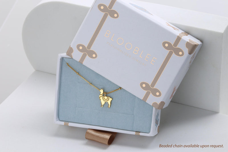 Dainty gold llama pendant with saddle blanket detail on a fine chain (7 of 15)