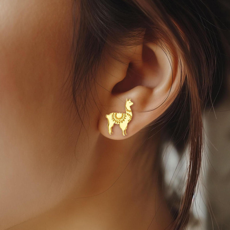 Pair of tiny gold llama stud earrings with tufted heads, shown on white (12 of 12)