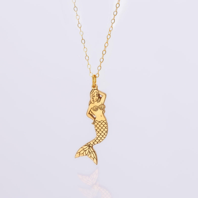 Small gold mermaid pendant with curled tail and sweeping hair on a thin chain (5 of 11)