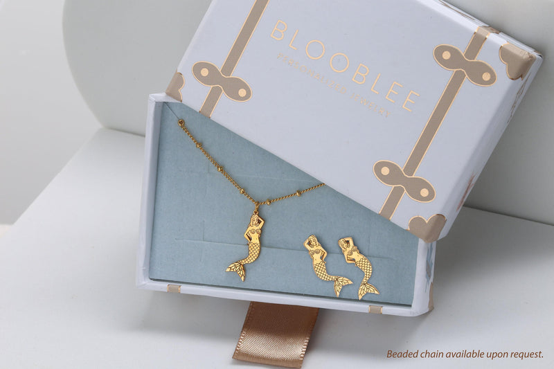 Small gold mermaid pendant with curled tail and sweeping hair on a thin chain (6 of 11)