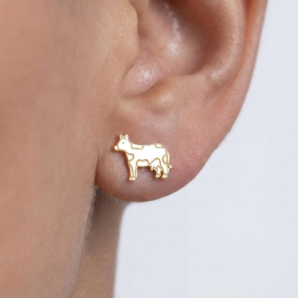 Pair of small highland cow face stud earrings in gold, fringe and ears visible (2 of 9)