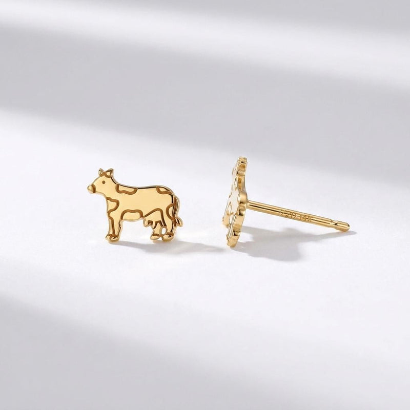 Pair of small highland cow face stud earrings in gold, fringe and ears visible (3 of 9)