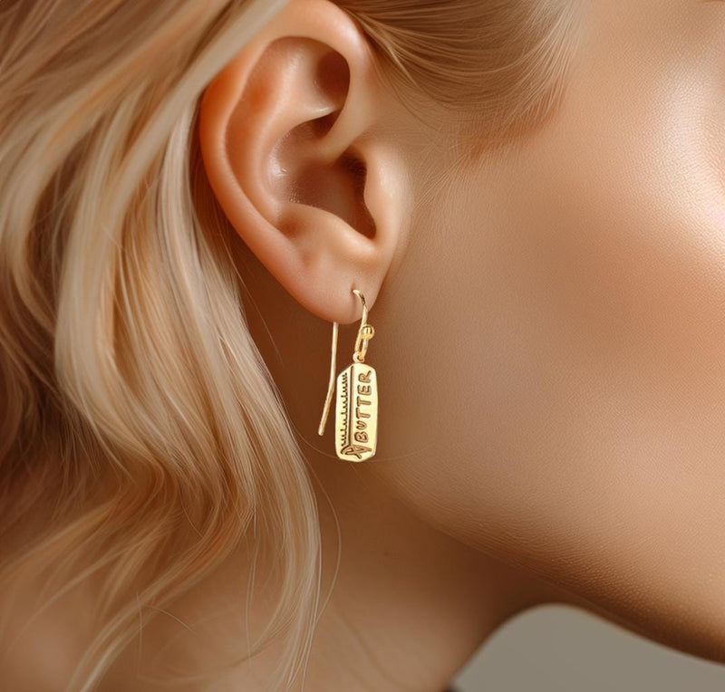 Pair of gold butter stick drop earrings hanging from small posts (3 of 10)