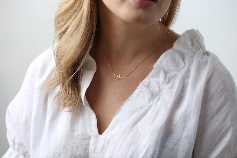 Small gold airplane pendant on a fine cable chain necklace (2 of 9)