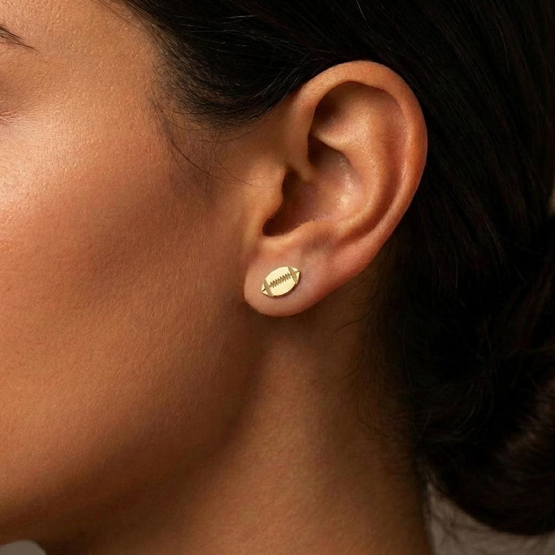 Pair of small gold football stud earrings with cut in laces (2 of 9)