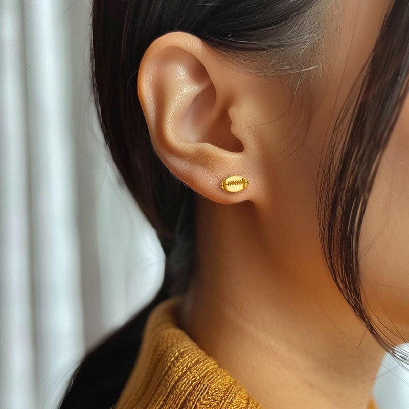 Pair of small gold football stud earrings with cut in laces (6 of 9)