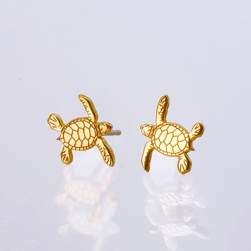 Pair of small turtle stud earrings in gold seen from above with a patterned shell (3 of 9)