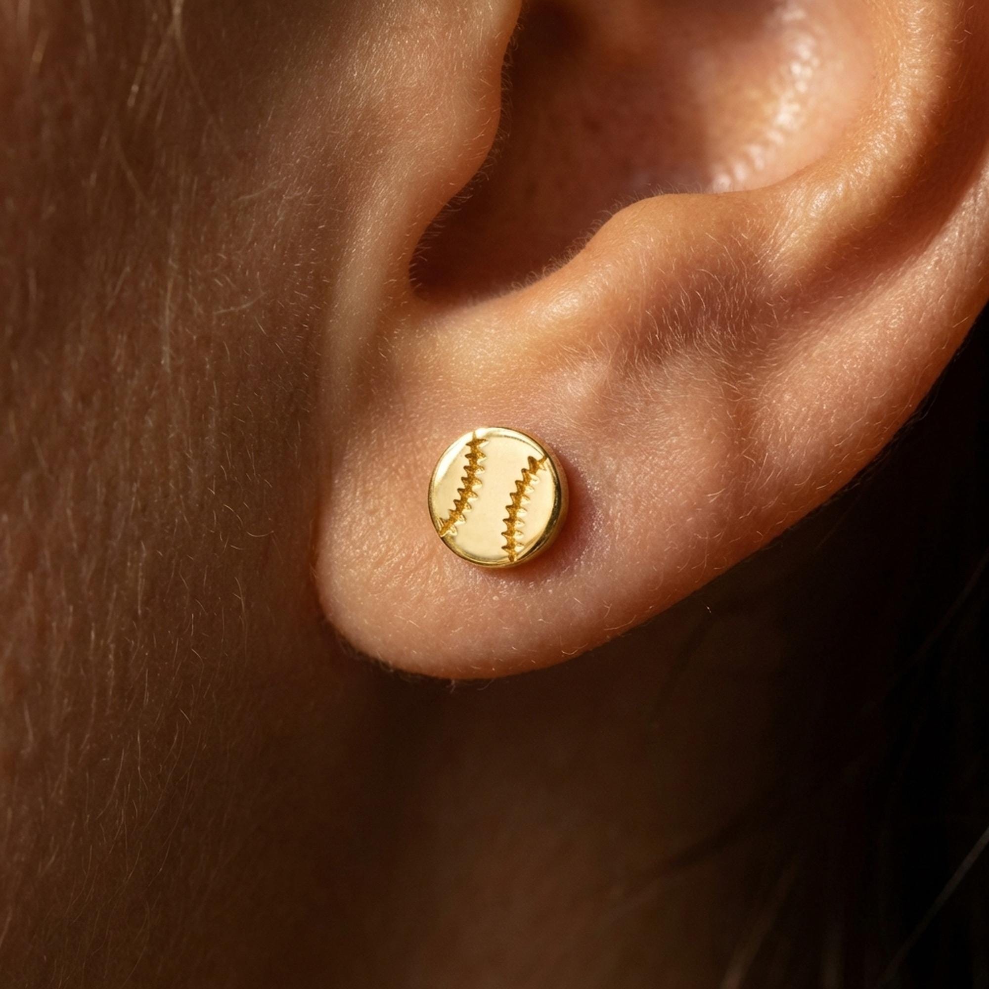 Pair of tiny round gold baseball stud earrings with curved stitch lines (2 of 10)