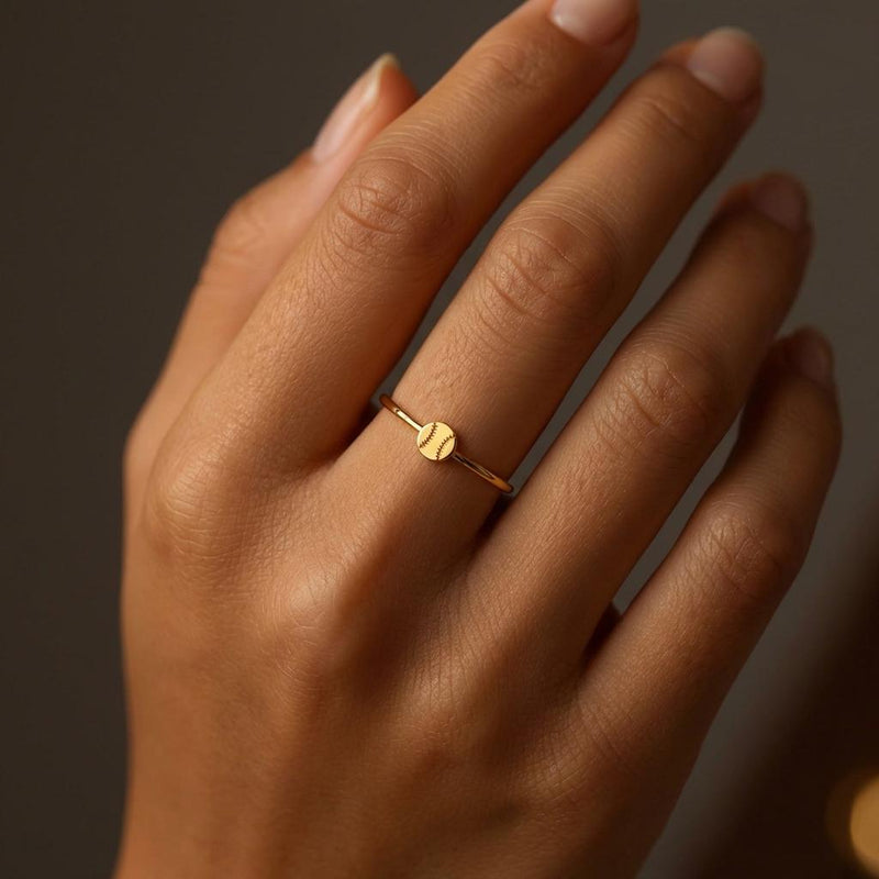Thin gold stacking ring with a tiny baseball on the top of the band (2 of 9)