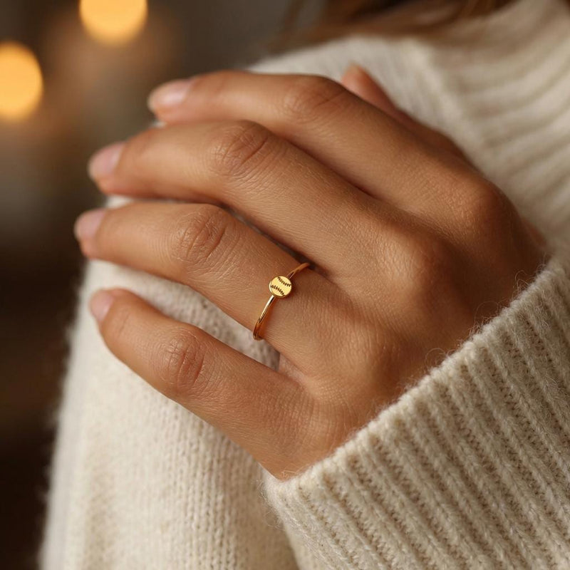 Thin gold stacking ring with a tiny baseball on the top of the band (3 of 9)