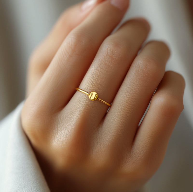 Thin gold stacking ring with a tiny baseball on the top of the band (9 of 9)
