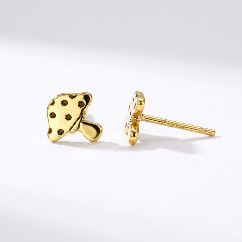 Pair of tiny gold mushroom stud earrings with spotted caps on white (2 of 10)
