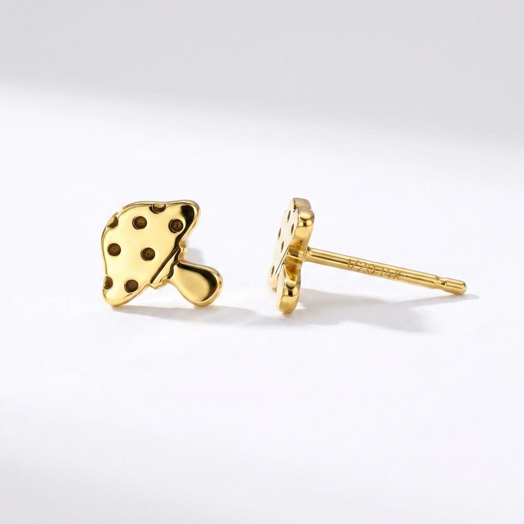 Pair of tiny gold mushroom stud earrings with spotted caps on white (2 of 10)