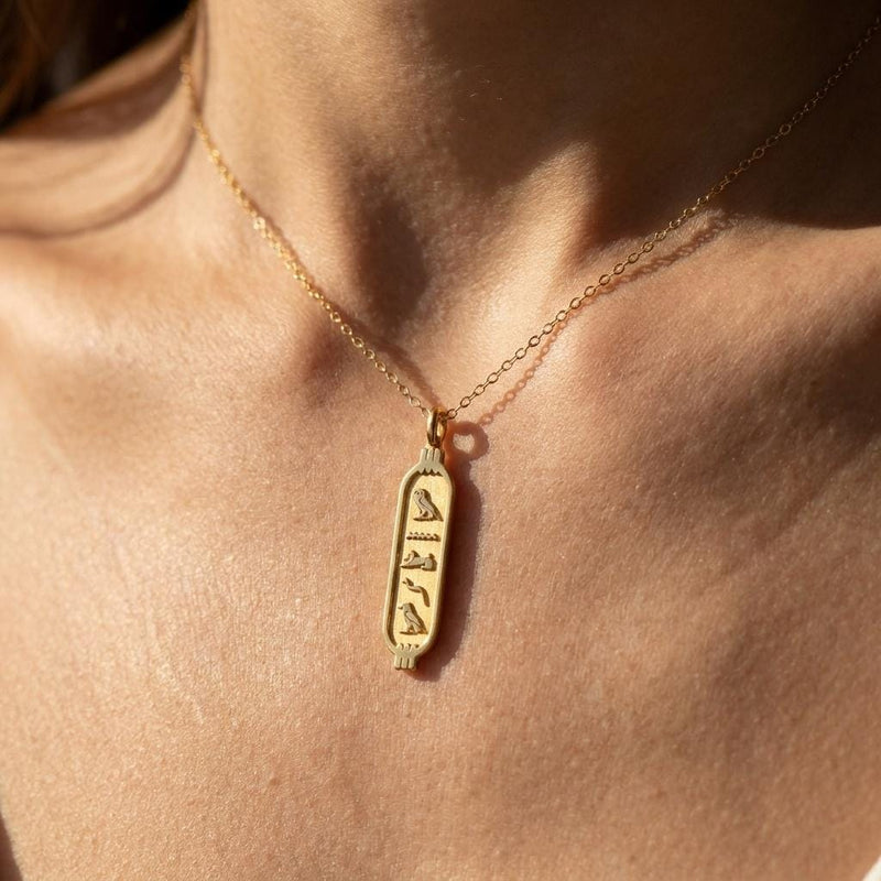 Elongated gold cartouche pendant on a fine cable chain, shown on white (2 of 11)