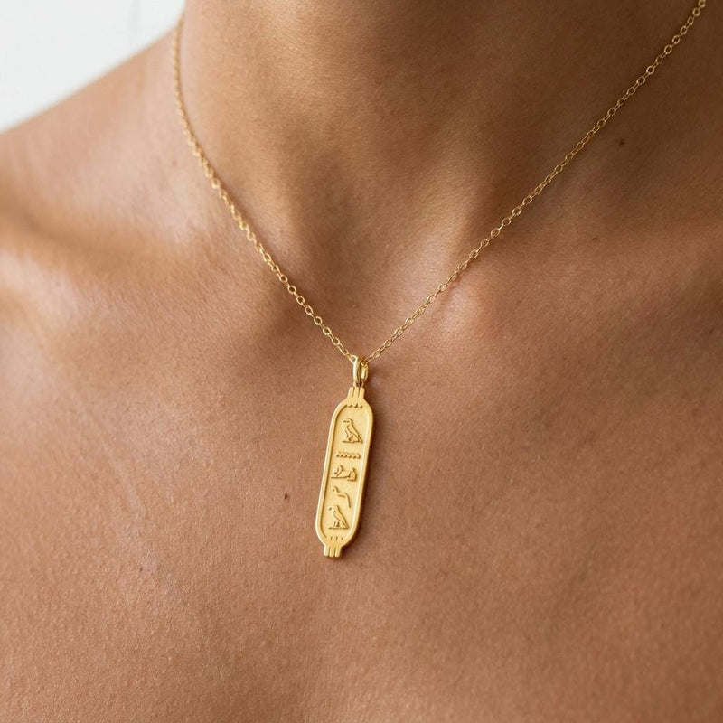 Elongated gold cartouche pendant on a fine cable chain, shown on white (3 of 11)