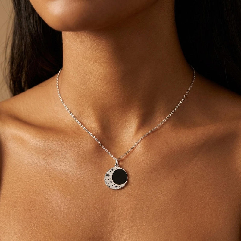 Round gold eclipse pendant with a bright outer ring on a fine chain (10 of 10)